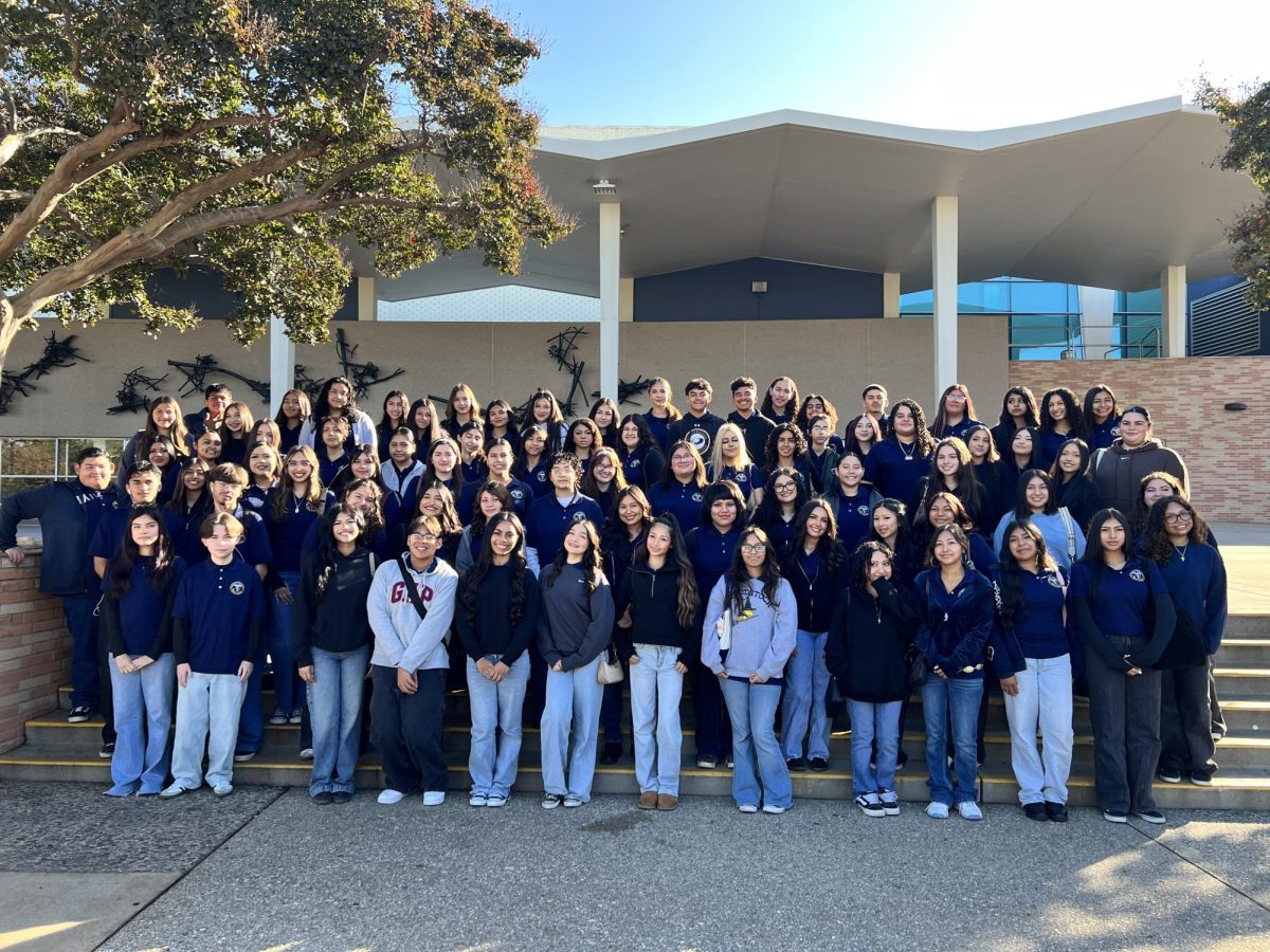 Health Academy Sophomores pose in front of the CSUF gymnasium.